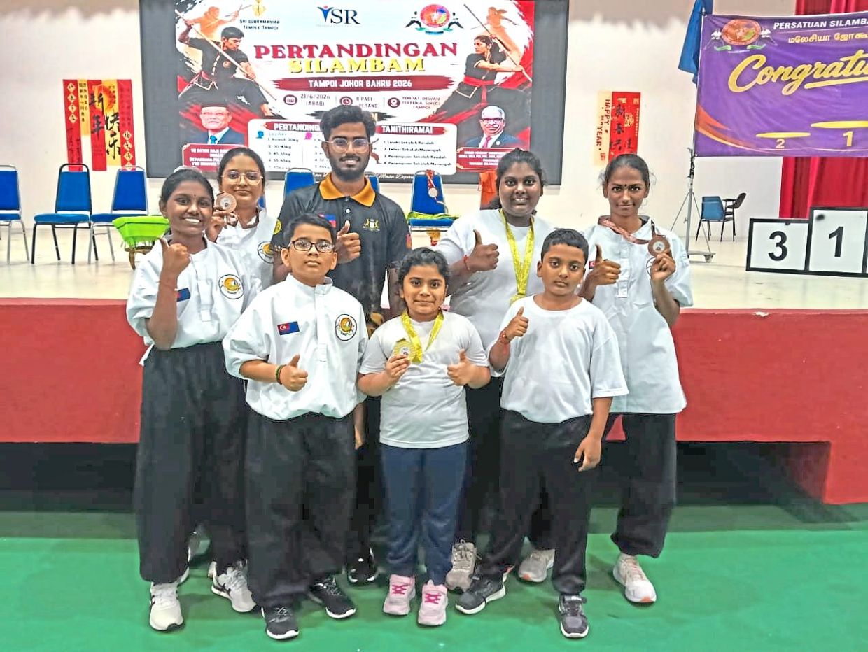 Moonashini (centre) with other participants celebrating their victories at the competition.