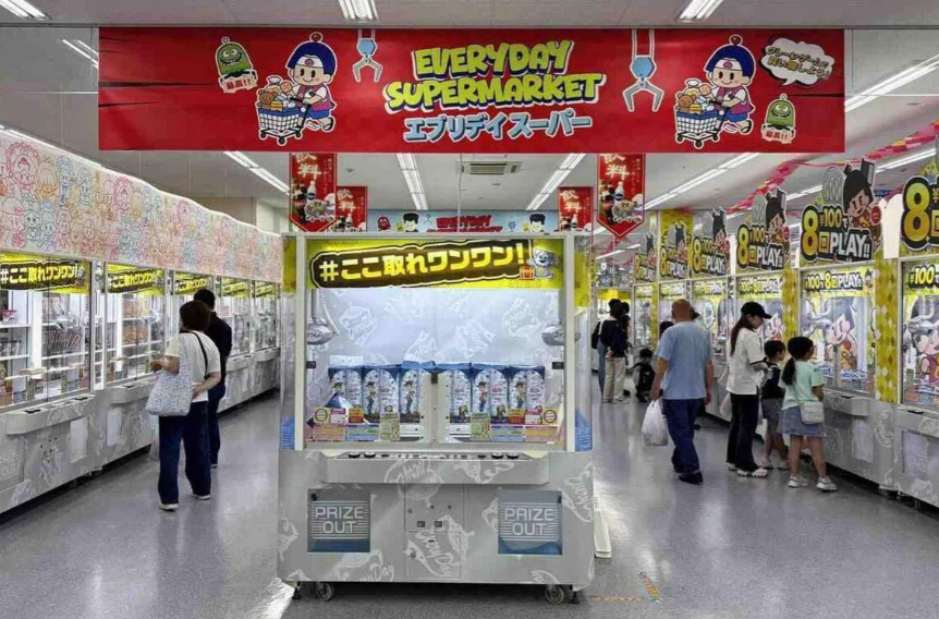 Visitors trying their luck at 105 different claw machines at the Everyday Supermarket. - The Japan News/ANN