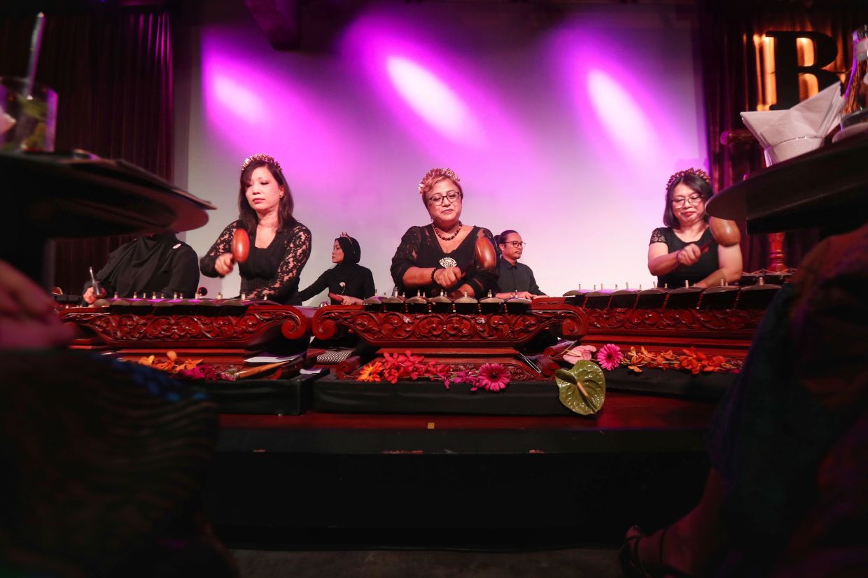 Sharmini (centre), who often named the demung and gong as her favourite gamelan instruments, performing live at the 'Gema Gamelan' concert in Kuala Lumpur in May 2023. Photo: The Star/Filepic
