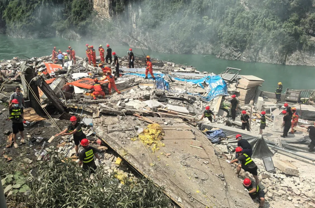 Rescue workers searching for survivors at the site of a landslide along Wujiang river in Pengshui Miao and Tujia Autonomous County, Chongqin on July 17, 2026. - Reuters