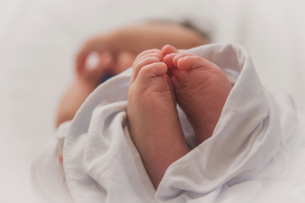 Foreign woman charged with murder after dead baby found in alley