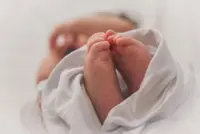 Foreign woman charged with murder after dead baby found in alley