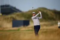 Golf-Australian Herbert moves top of Open leaderboard with birdie blitz