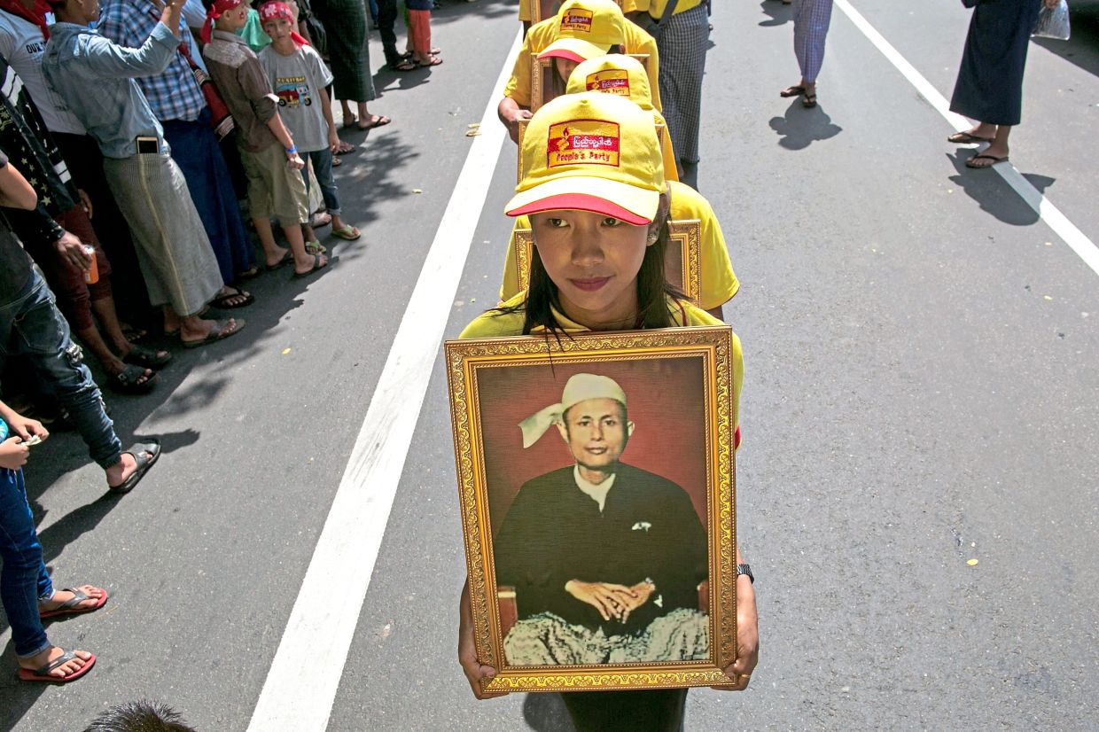 A portrait of the late general being paraded during the Martyrs’ Day ceremony in Yangon in July 2019. — AFP