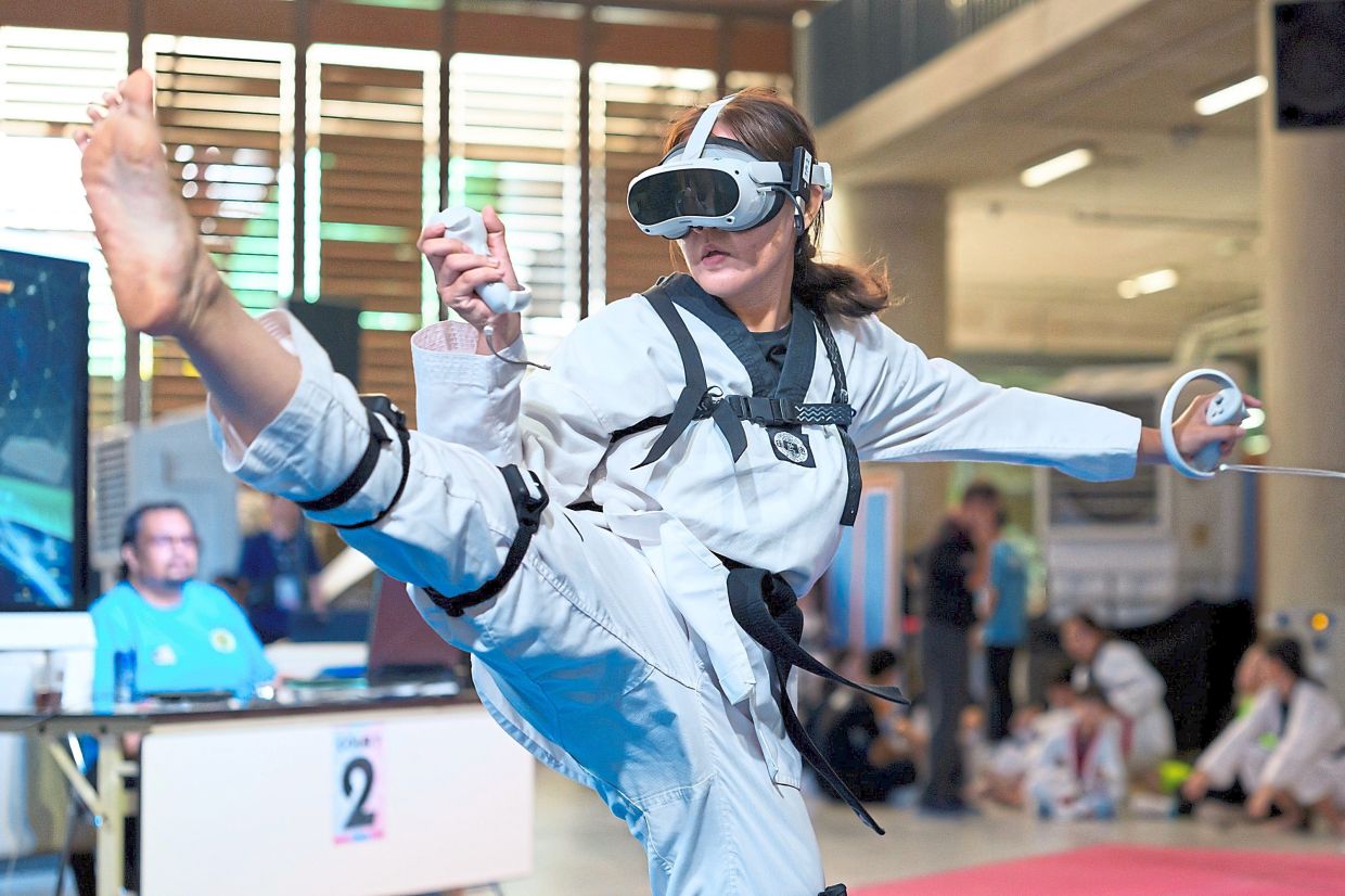 A virtual taekwondo competitor performs a high kick during a competitive event.