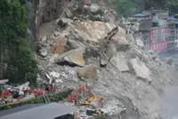 Southern China braces itself for more rain, Chongqing landslide search continues; 34 people remain missing