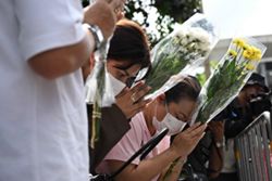 Woman dies week after Bangkok bar fire, raising toll to 34