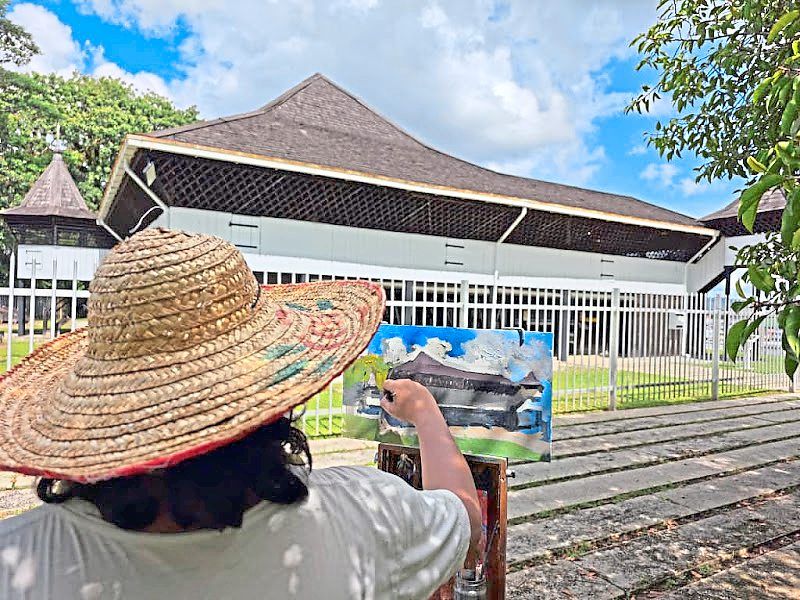 Brandon Ritom painting Fort Alice on location in Sri Aman. - Photo courtesy of Hoan Gallery