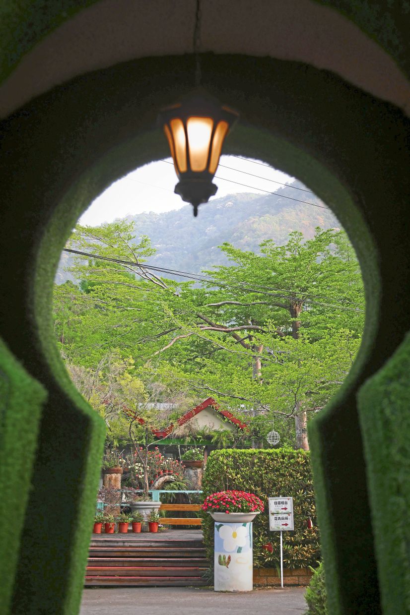A keyhole-shaped opening frames the sweeping 13.2ha grounds of Tai-Yi Ecological Leisure Farm, where the landscape transforms vividly with each of the four seasons.