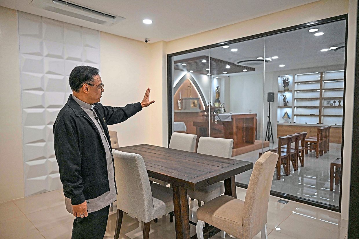 Through the looking glass: Syquia showing a viewing room with a one-way mirror overlooking the chapel where exorcisms are performed, allowing family members and trainee exorcists to observe the rituals. — AFP