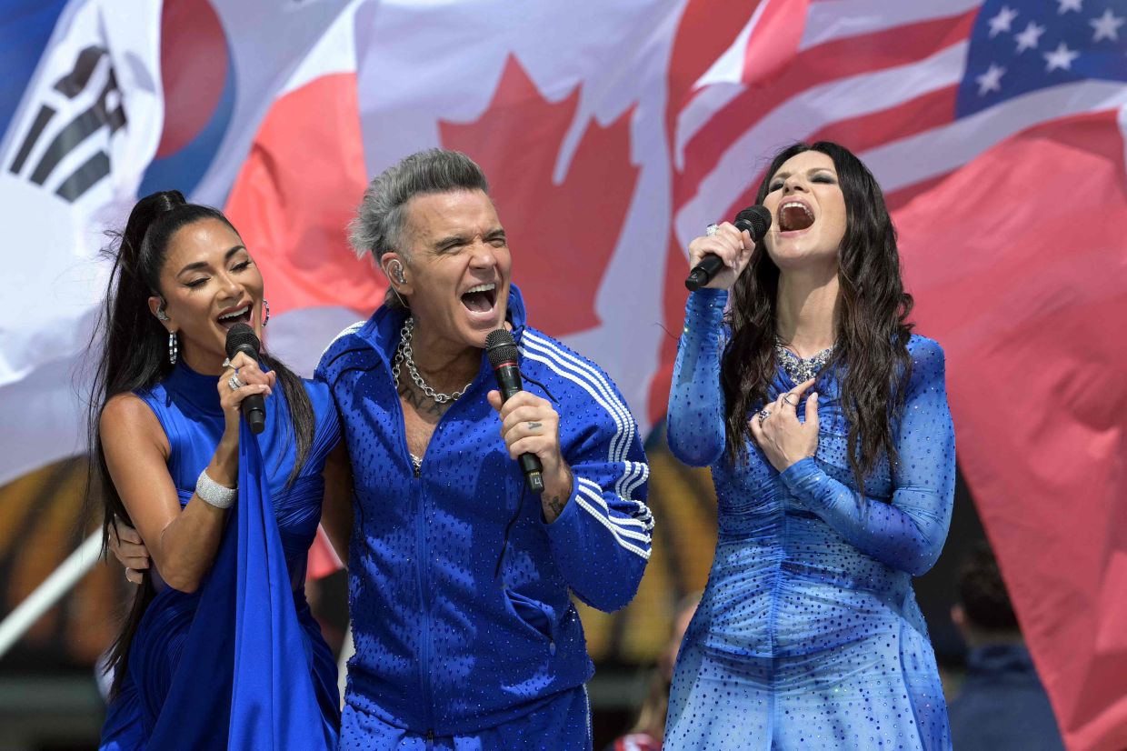 Nicole Scherzinger, Robbie Williams and Laura Pausini. Photo: AFP