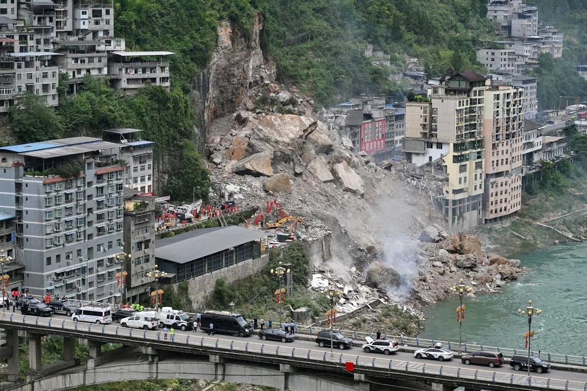 Rescue workers searching for survivors at the site of a landslide in Pengshui county in Chongqing, China, on July 17. - Photo: Reuters