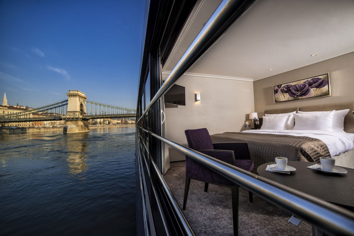 Unlike conventional river cruise cabins, every bed faces the scenery, ensuring the landscape remains the focal point of the guest experience.