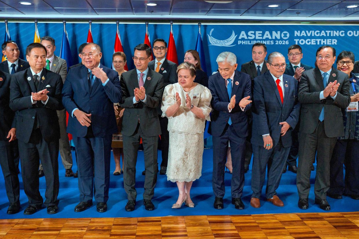 (Front row L-R): Thailand's Deputy Prime Minister and Foreign Minister Sihasak Phuangketkeow, East Timor's Foreign Minister Bendito dos Santos Freitas, Vietnam's Deputy Foreign Minister Dang Hoang Giang, Philippine Foreign Secretary Theresa Lazaro, Singapore's Permanent Secretary of Foreign Affairs Albert Chua, Brunei's Foreign Minister Erywan Yusof, Cambodia's Deputy Prime Minister and Foreign Minister Prak Sokhonn, and Indonesia's Director General for ASEAN Cooperation Ina Hagniningtyas Krisnamurthi applaud after posing for a photo with representatives from the ASEAN Intergovernmental Commission on Human Rights (AICHR) Representatives during the ASEAN Foreign Ministers' Meeting at the Philippine International Convention Center in Pasay, Metro Manila on July 20, 2026. -- Photo by Ezra Acayan / AFP