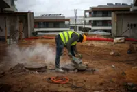 Analysis-Portugal's migrant curbs hit construction firms working to solve housing crisis