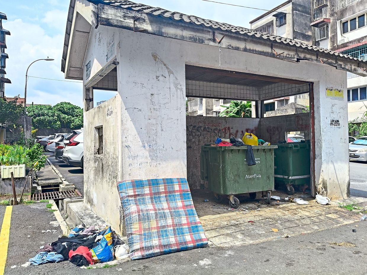 The rubbish chamber at Flat Taman Kobena in Cheras, Kuala Lumpur, has become a frequent dumping ground for outsiders.