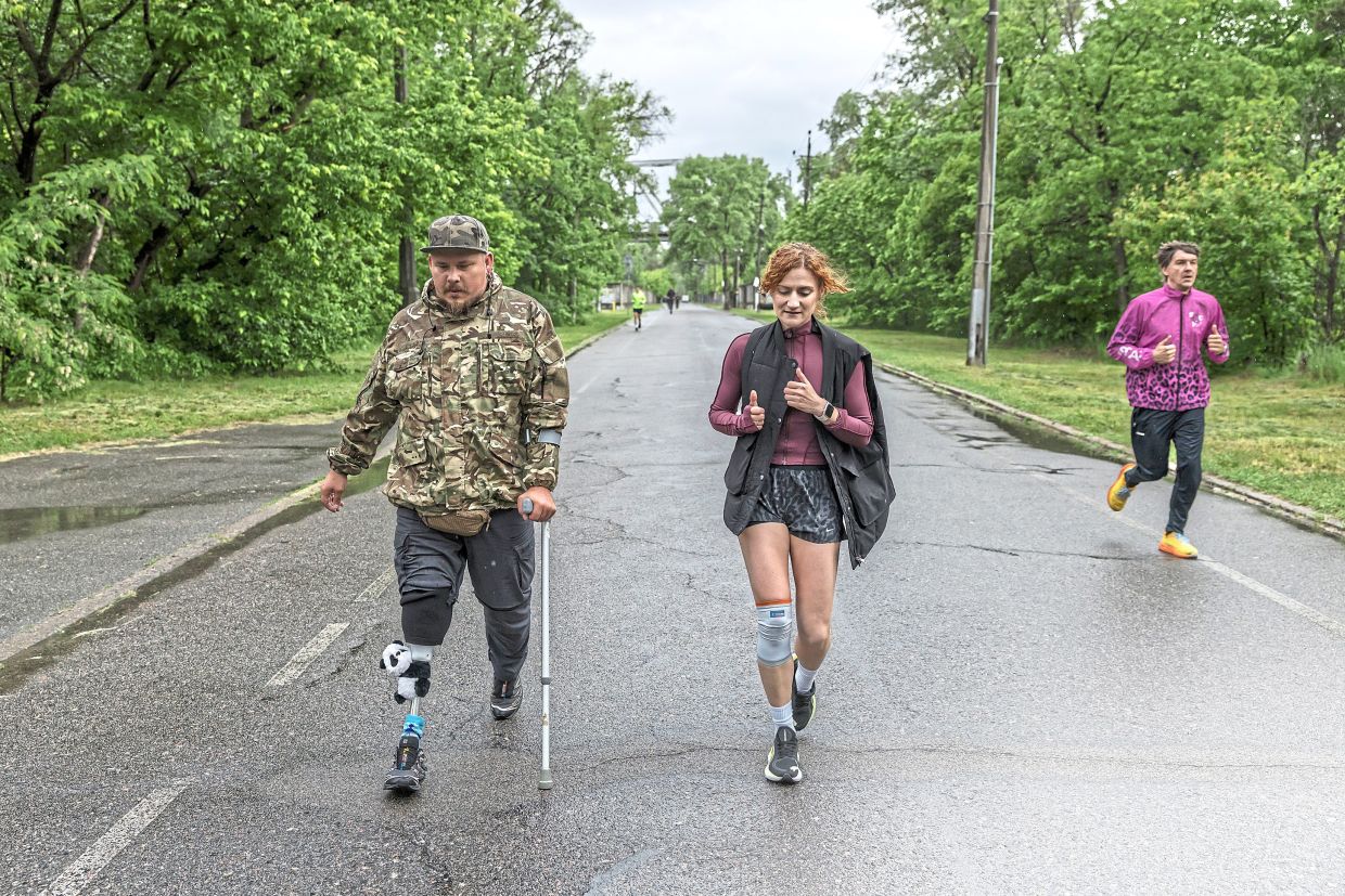 Yaremenko participating in a charity run in Kyiv, on May 30, after losing his leg in the Sumy region last year. As the number of amputees in Ukraine soars, many are bonding by learning new sports, challenging both their bodies and their ideas of what they can do. — Oksana Parafeniuk/The New York Times