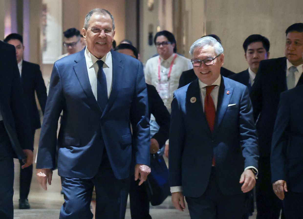 This photo taken and handout by Russia's Foreign Ministry on July 21, 2026 shows Laos Foreign Minister Thongsavanh Phomvihane (right) and Russia's Foreign Minister Sergey Lavrov walking to start their meeting on the sidelines of the Asean summit of foreign ministers in Pasay, Metro Manila, on July 21. - AFP