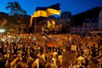 Ukraine's Zelenskiy meets commanders as street protests mount