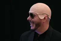 US rapper Pitbull sets bald cap world record at London show