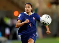 Soccer-Spurs sign defender Sombath from Lyonnes