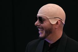 US rapper Pitbull sets bald cap world record at London show