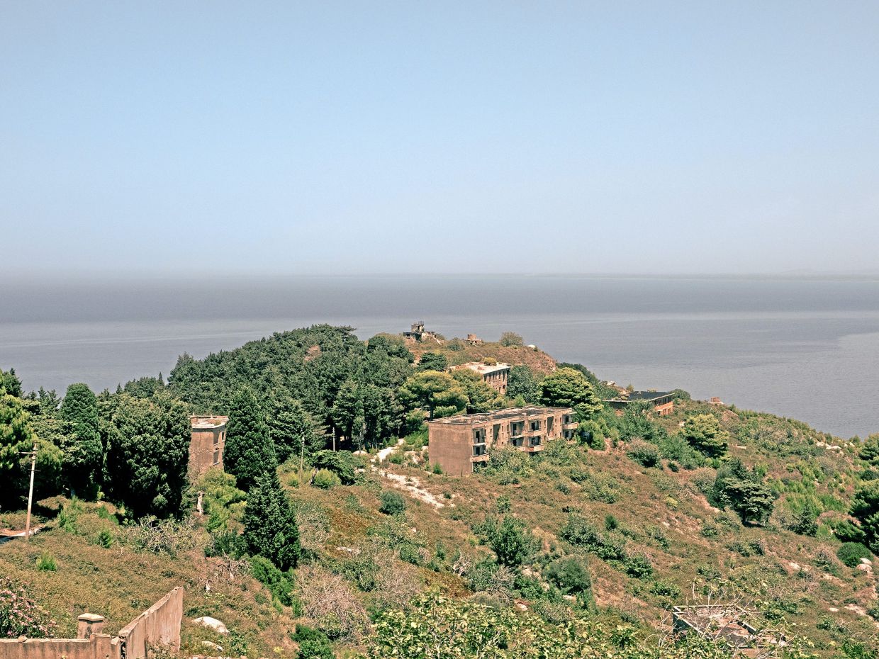 A view of Sazan Island in this file pic from July 14, 2024. It was once the site of Italian, Soviet and Albanian military bases, but is now in ruins. — Ilir Tsouko/The New York Times