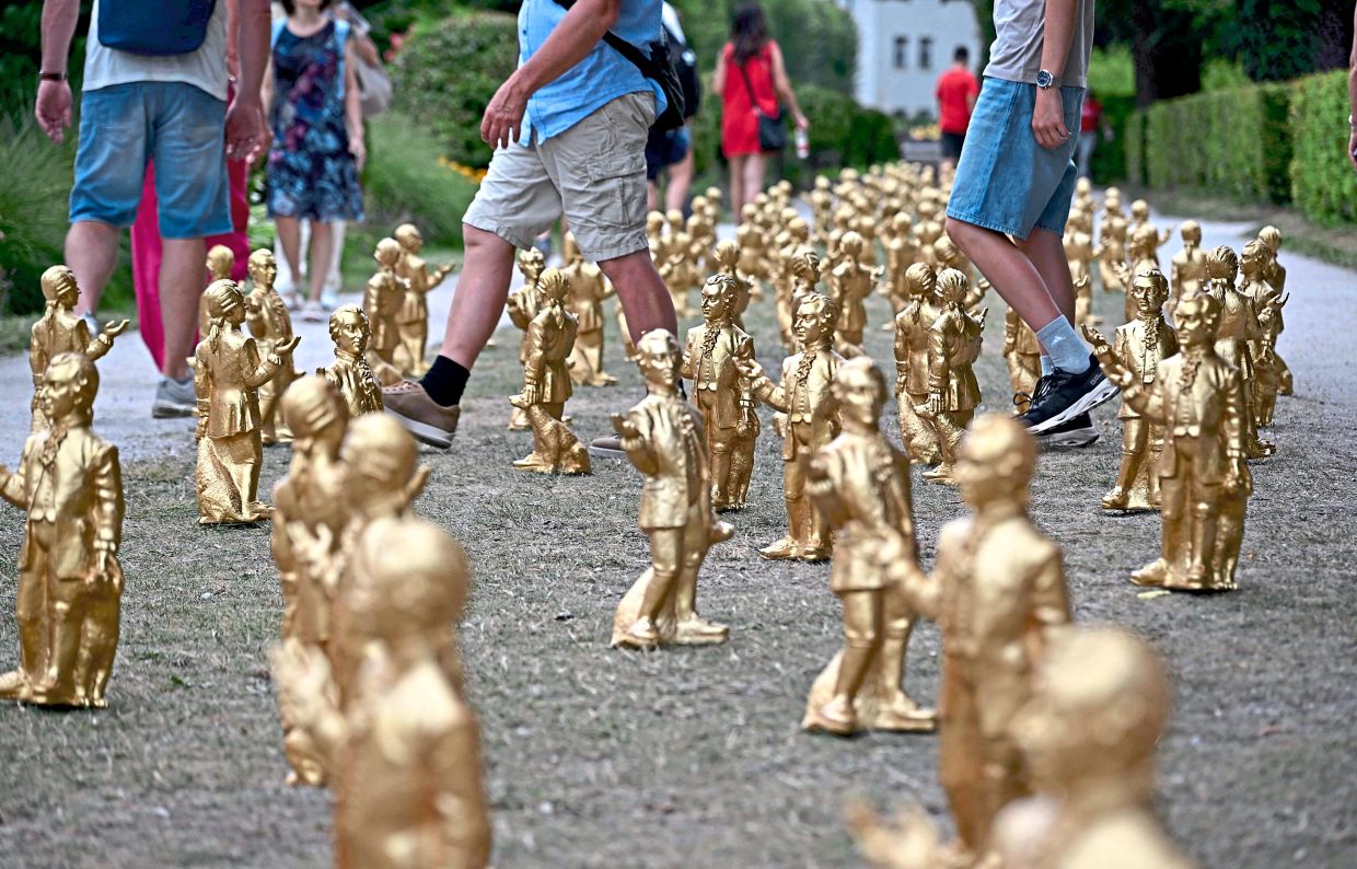 To give the statues a human touch, Horl depicted the composer with his favourite dog, Pimperl. Photo: AP