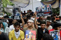Under soaring pressure, India's education minister promises reforms and debate