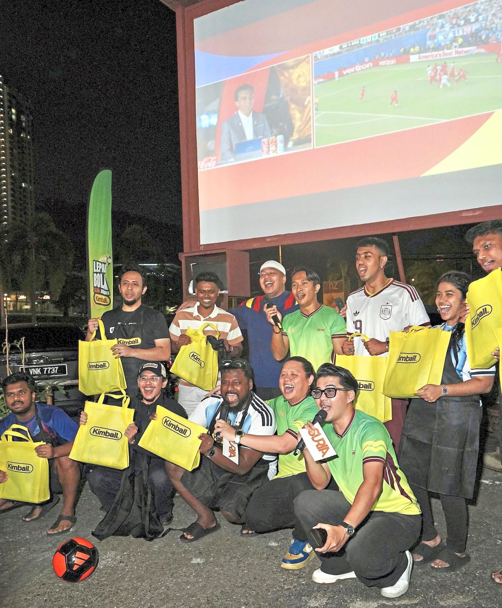 The Suria FM team and participants during a football-themed activity.