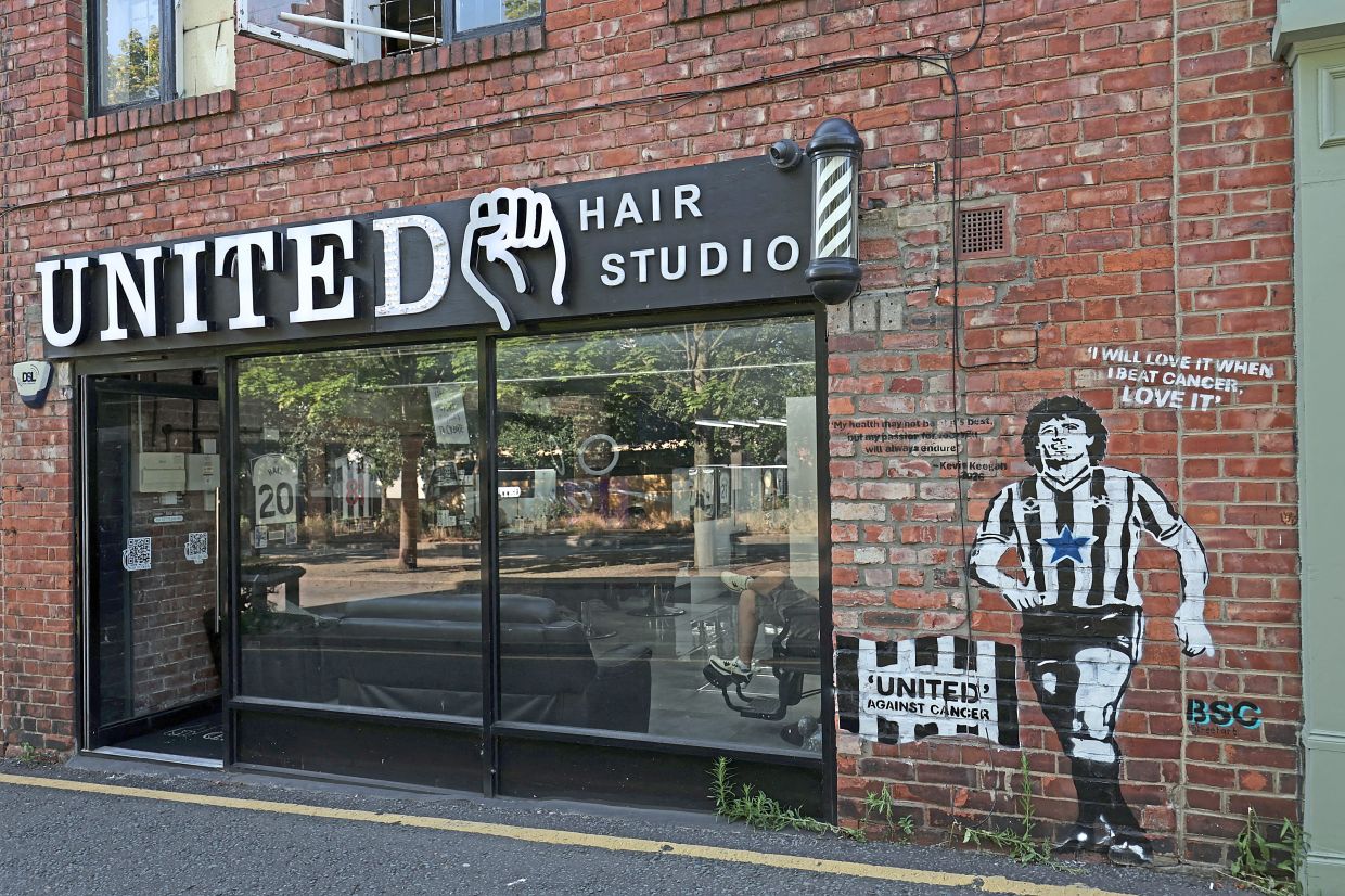 A mural of Keegan is seen outside a barbershop in Newcastle near the stadium following his passing.
