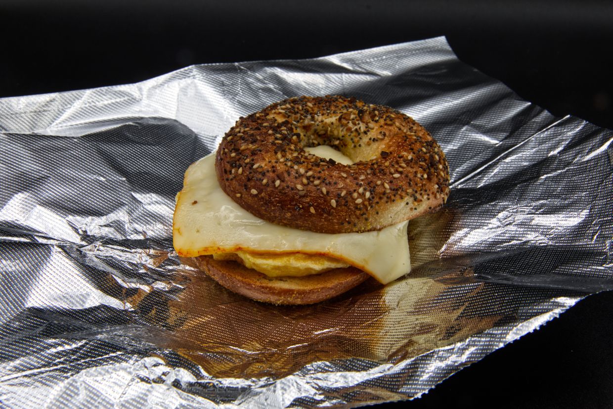 A breakfast egg and cheese on an 'everything' bagel.