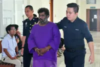 Man claims trial to 12 counts of armed robbery, cheating in Klang