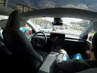 Tesla's once-bullish tone on robotaxis shifts