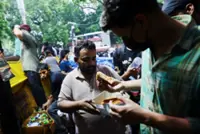 Supporters flood India's 'cockroach' party protesters with food