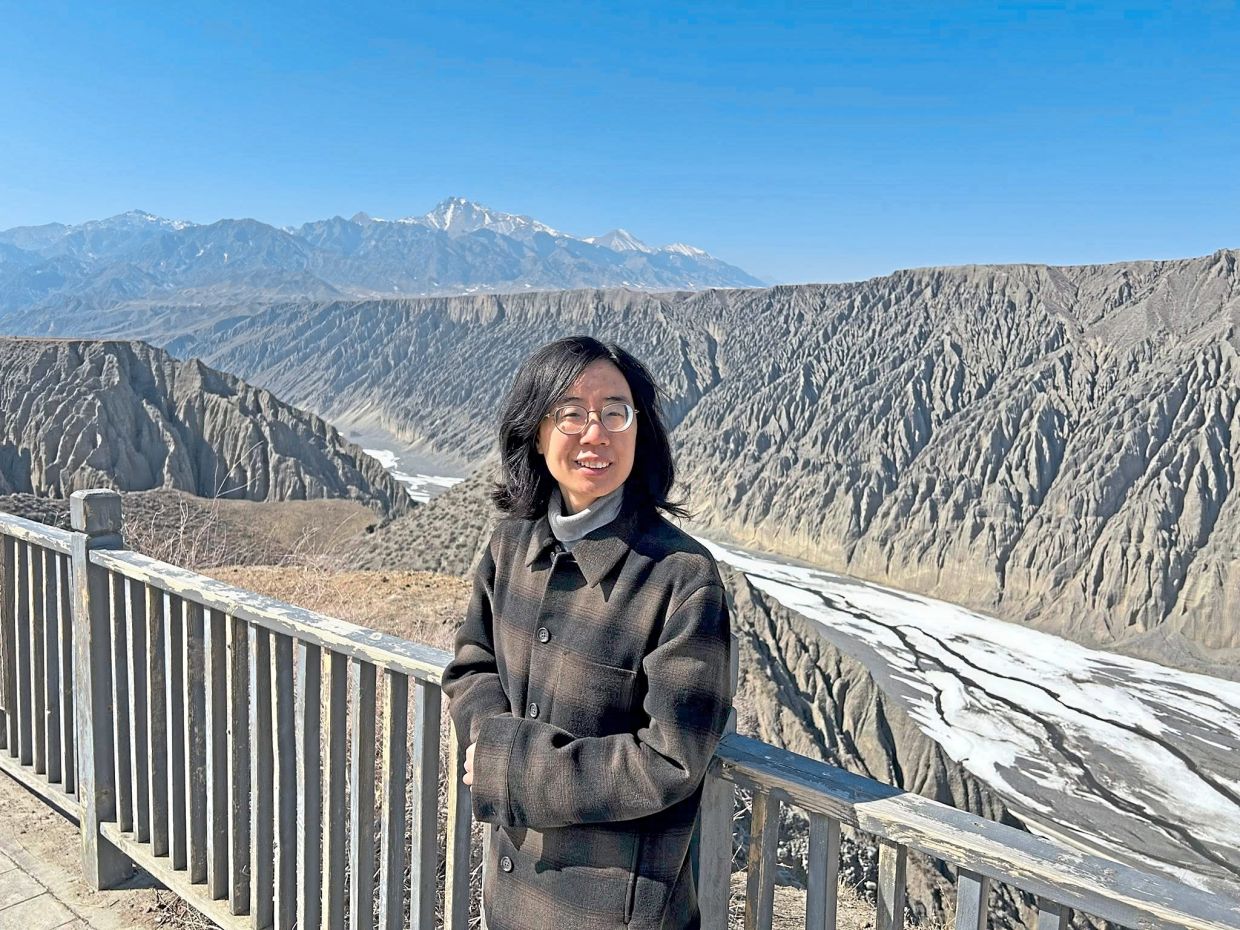 The writer at Dushanzi Grand Canyon.