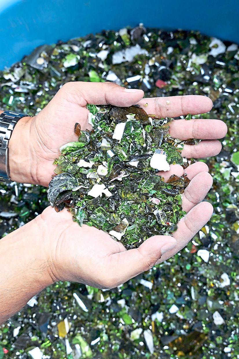 Discarded glass, crushed into particles.