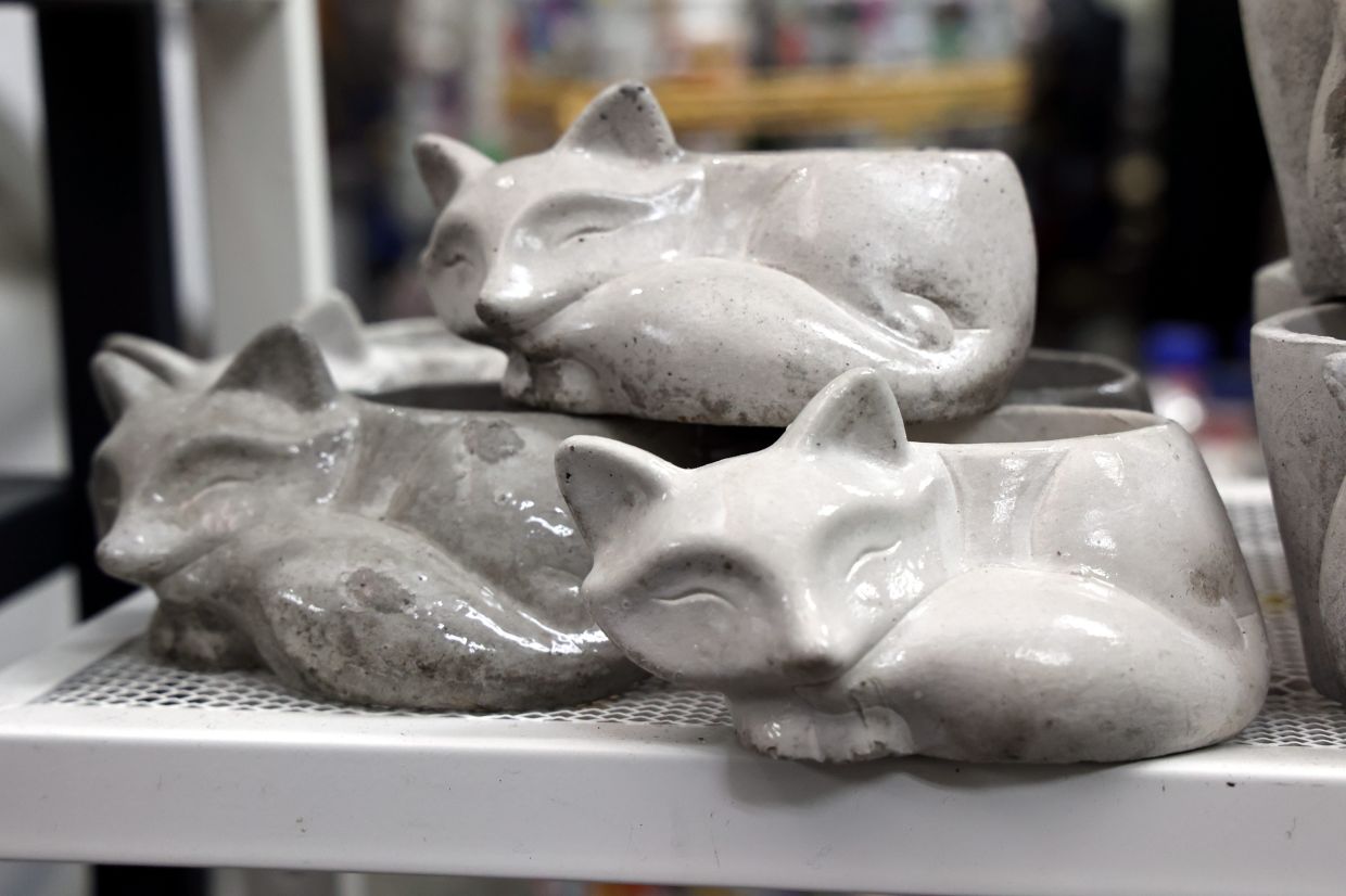 Cute fox figurines made from crushed glass and cement.
