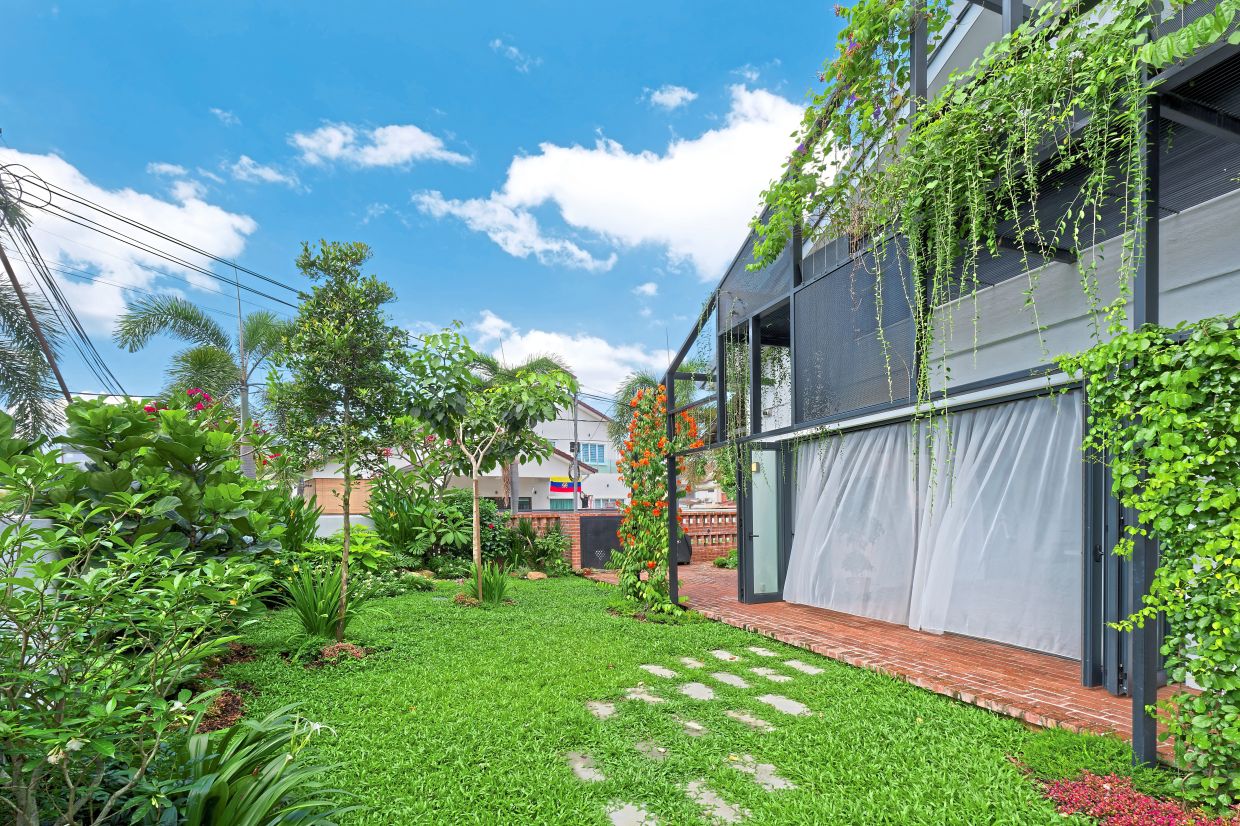 The owner enjoys gardening, growing from flowering plants to passion fruit, even breeding bees for pollination.