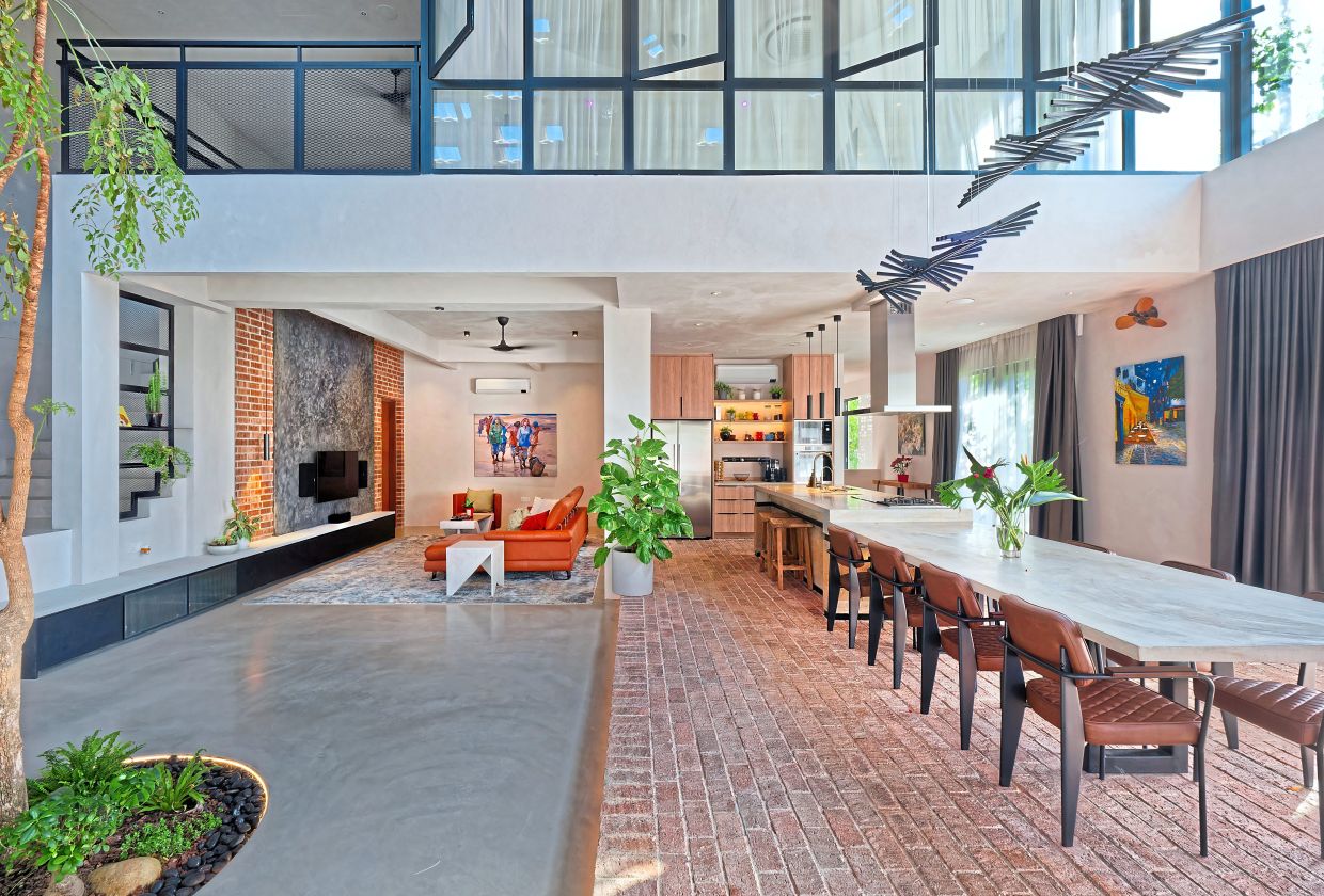 The seamless, open-plan living, kitchen and dining spaces.