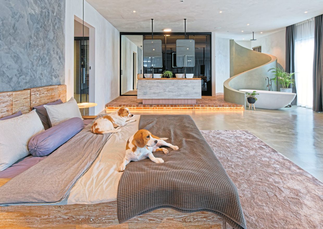 The master bedroom with the open-concept bathroom.