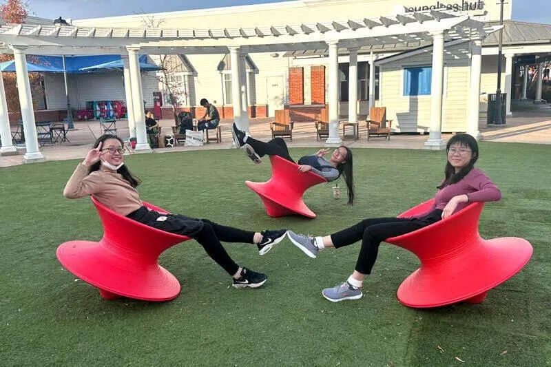 New Ke Yue (right), 19, with her former classmates from River Valley High School in December 2023, at the Tanger Outlets in Pennsylvania, during the school's two-week bicultural studies programme in the United States. - Photo: Courtesy of NEW KE YUE
