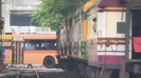 Bangkok bus stranded across railway tracks after sudden traffic stop, driver disciplined