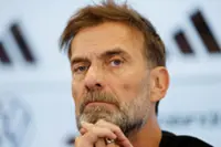 Soccer-Klopp warns media over family privacy as he takes Germany job