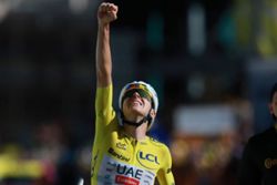 Cycling-Pogacar climbs Alpe d'Huez in record time to win Tour de France stage 19