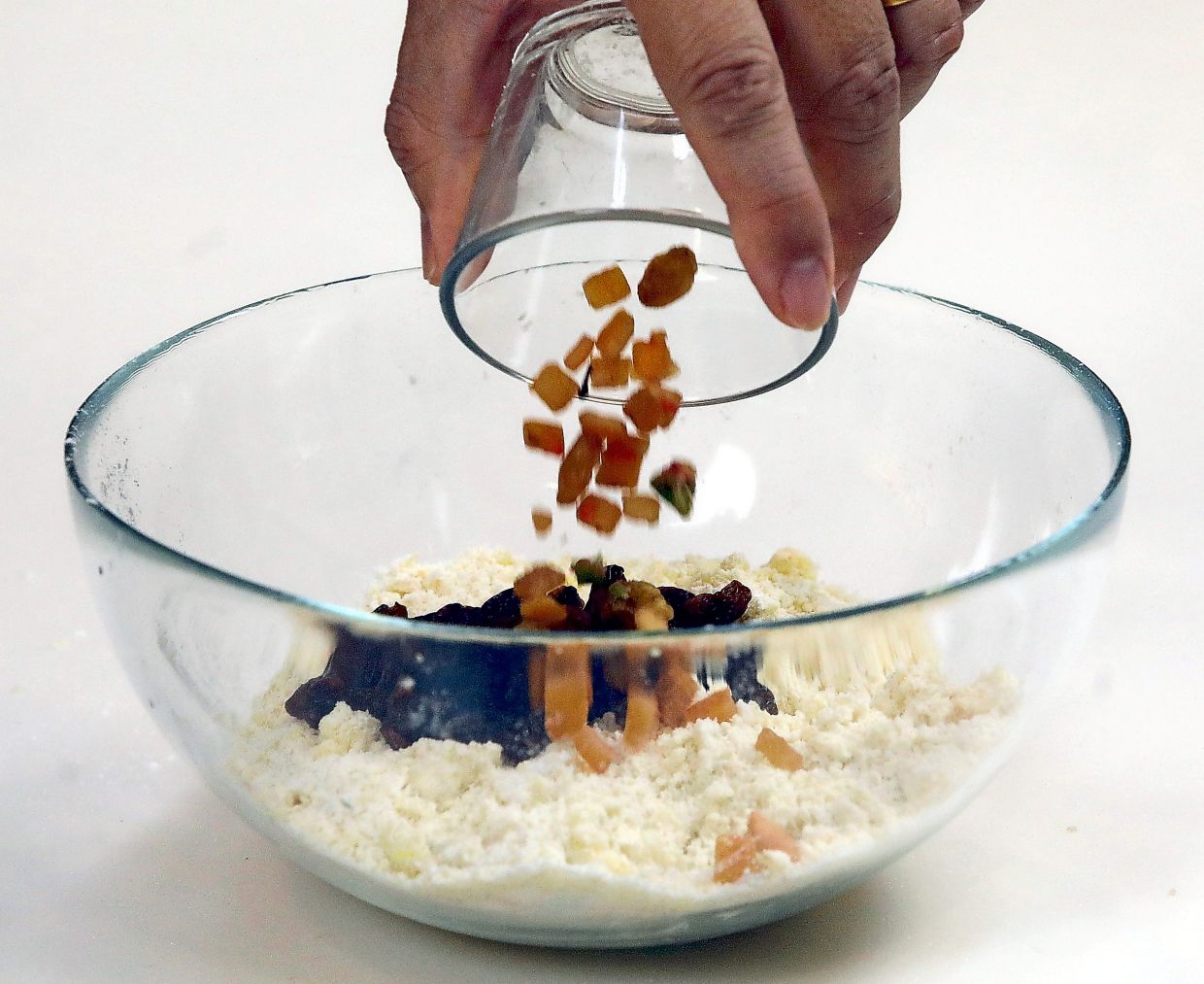 Sift together flour, baking powder, salt and sugar, then cut in butter and rub in until it resembles breadcrumbs.