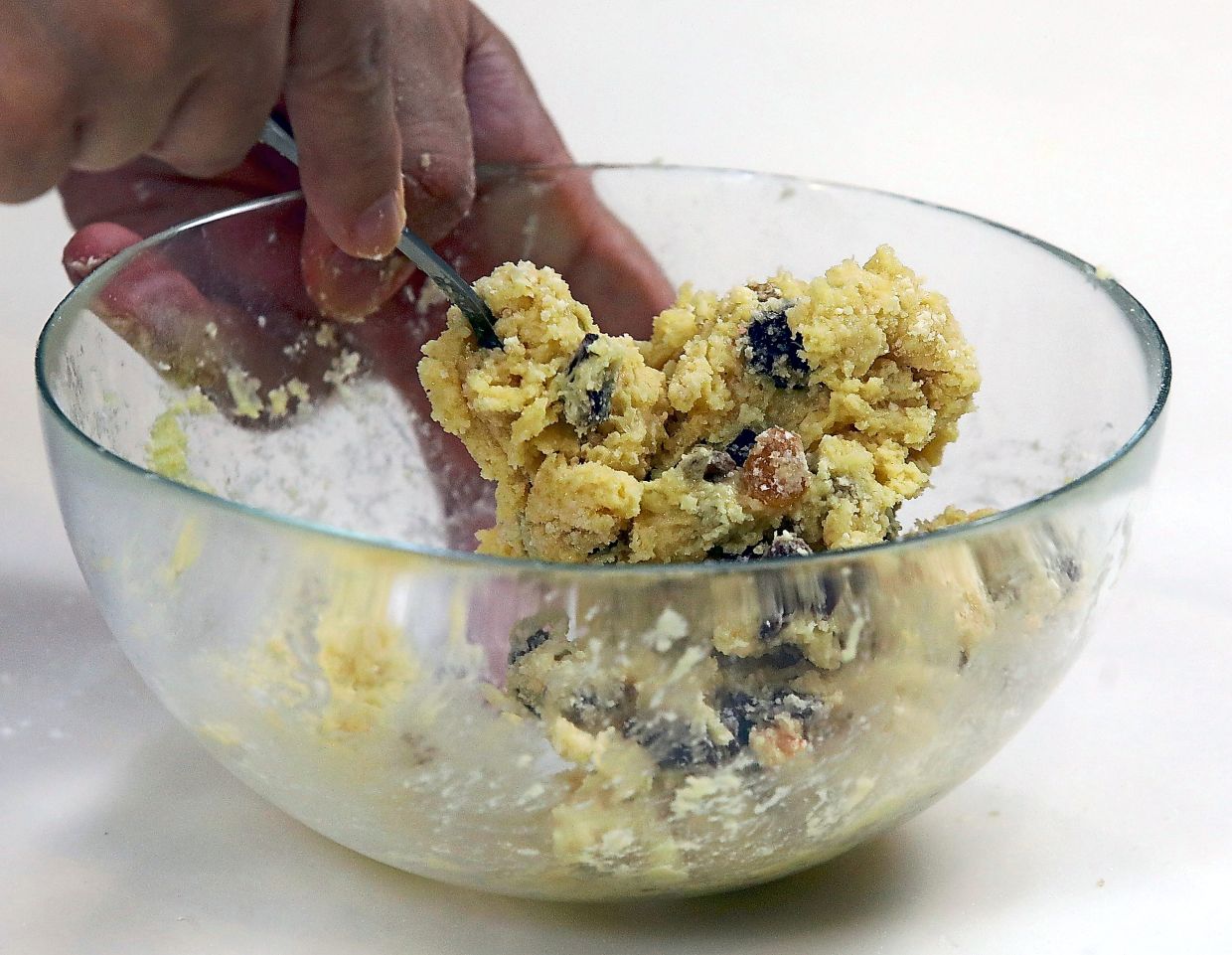 When the dry ingredients resemble breadcrumbs, stir in egg beaten with vanilla until it forms a stiff dough.