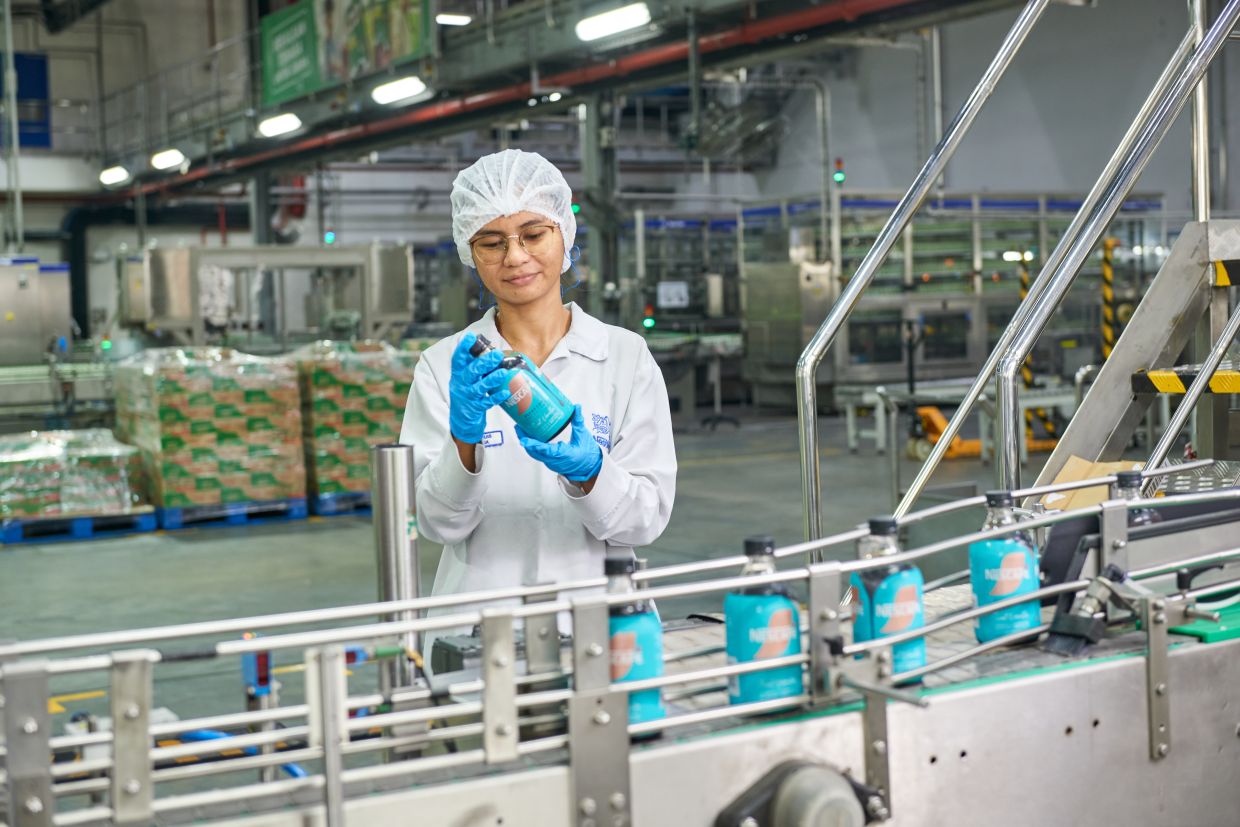 An employee conducting quality checks at the company’s manufacturing facilities that hire a 100% Malaysian factory workforce.
