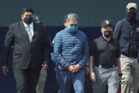 Honduras ex-President Hernandez returns home after Trump pardon