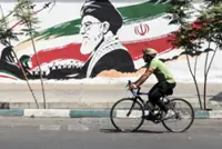 Iran says it has halted Middle East attacks as US holds fire after two weeks of escalation